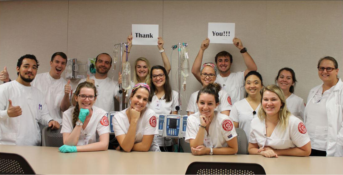 Photo of Mennonite College of Nursing students saying thank you.